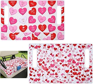 a bed with a heart shaped bedding and a bed with a pink heart shaped