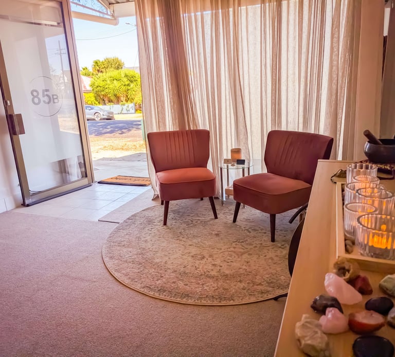 Comfortable, pink, velvet seating at the Sacral Space Clinic. 