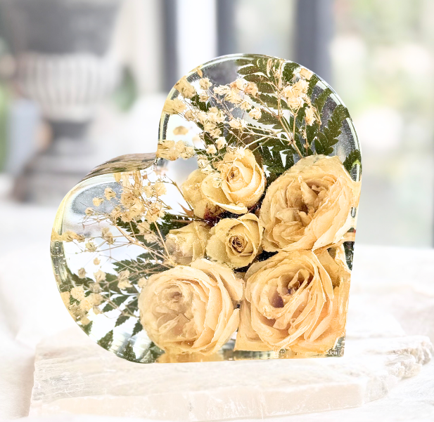Preserved wedding bouquet with yellow roses in a heart-shaped resin block.