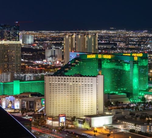 The green glowing MGM Grand Hotel and Casino on the Las Vegas Strip at night.