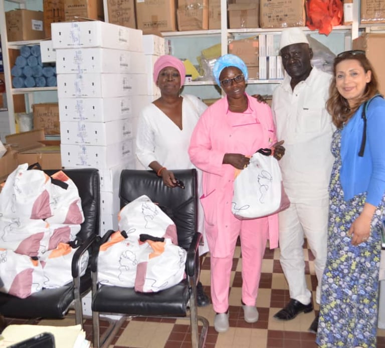 a group of people standing around a room with boxes of boxes