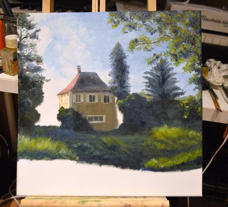 an unfinished painting of a house in a studio