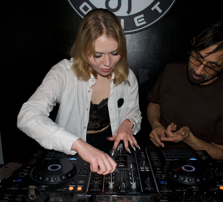 Student practicing beatmatching during one-on-one DJ lesson at Prague DJ Society
