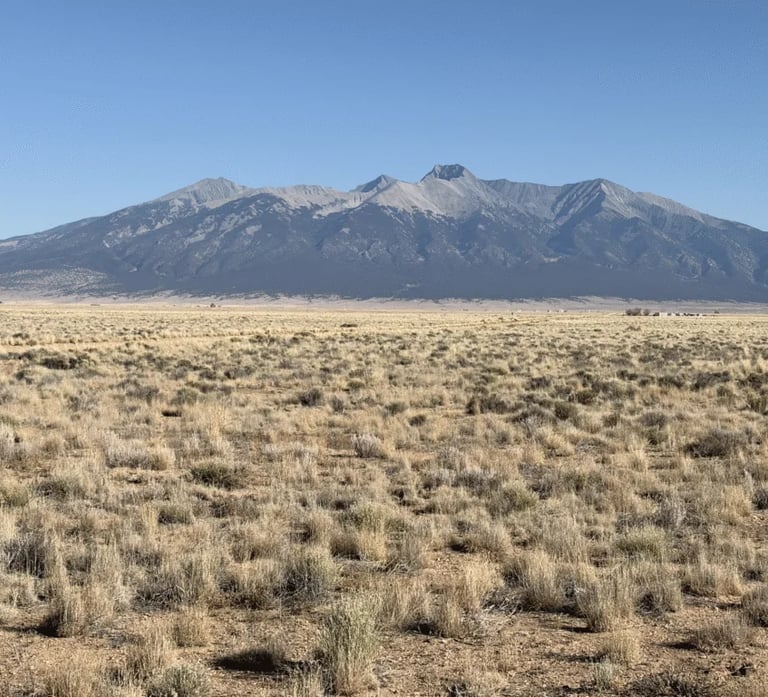 a mountain view of a mountain range with a mountain in the background