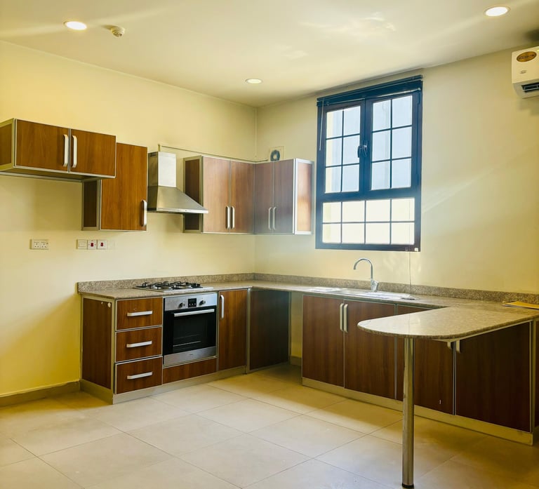 furnished kitchen in residential property owned by the other dimension real estate agency in Bahrain