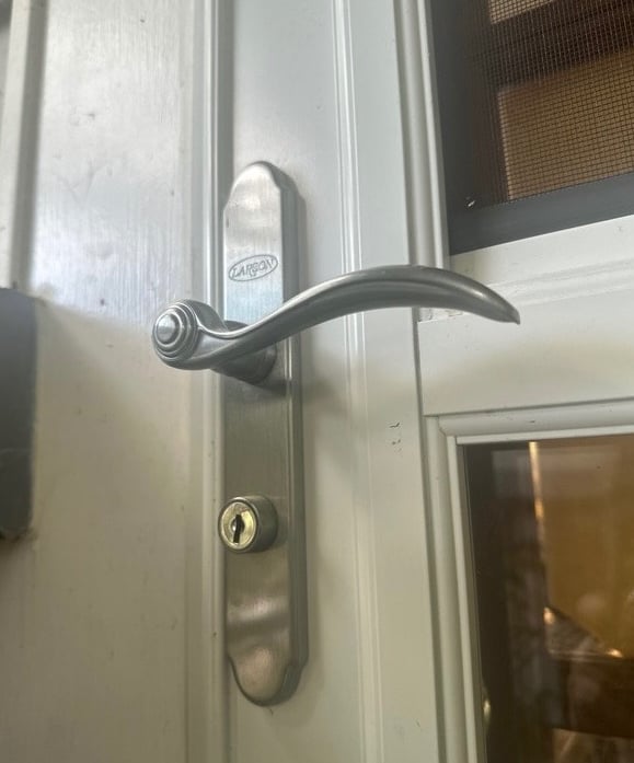 Door keyhole representing residential locksmith services in Fletcher, NC including smart locks, rekeying, & lockout