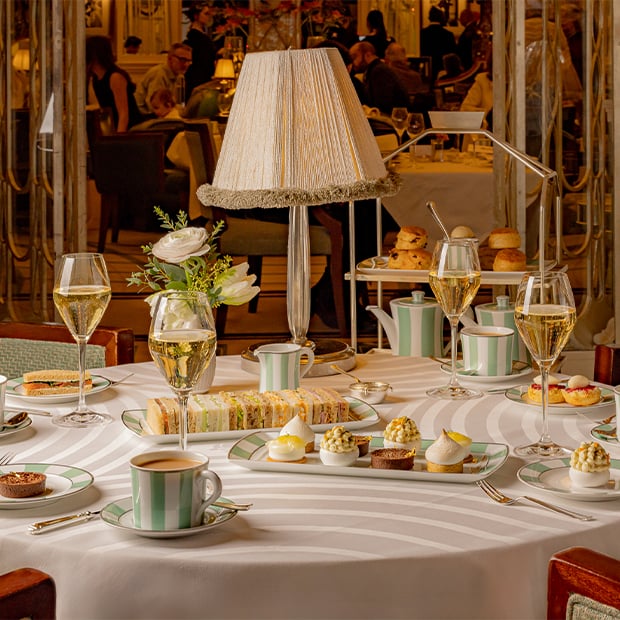 Elegant afternoon tea at Claridge’s with pastries and champagne.