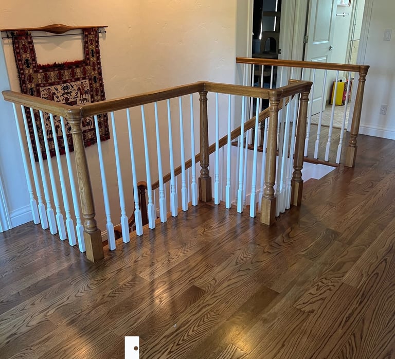 a staircase way with a Hardwood floor and a stair case
