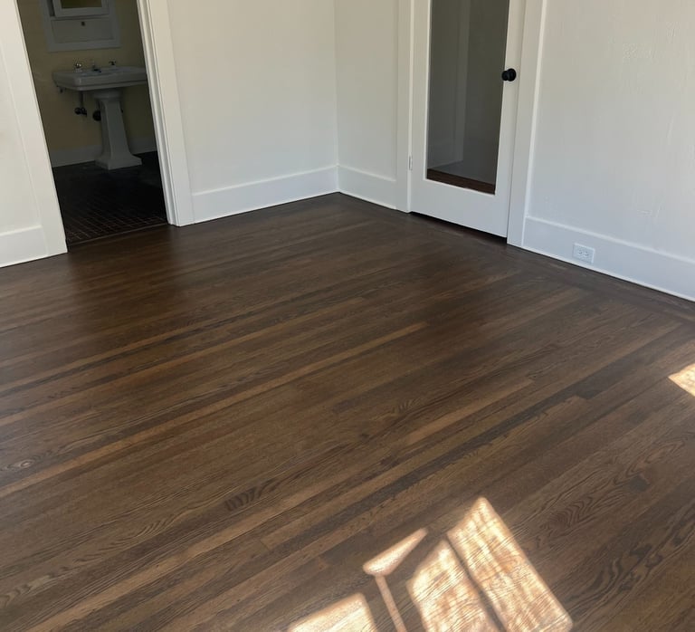 a room with a wooden floor and a door