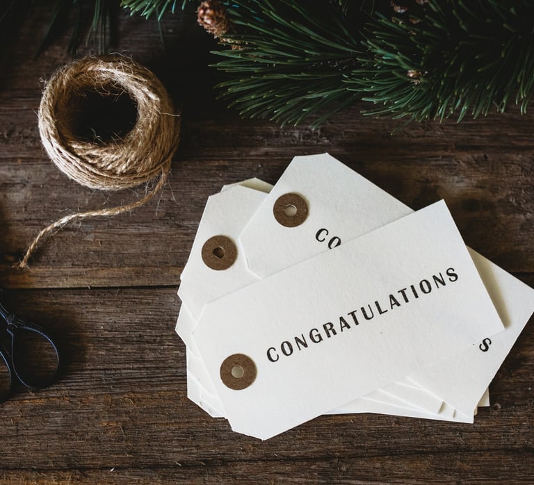 a pair of scissors and a pair of scissors on a wooden table