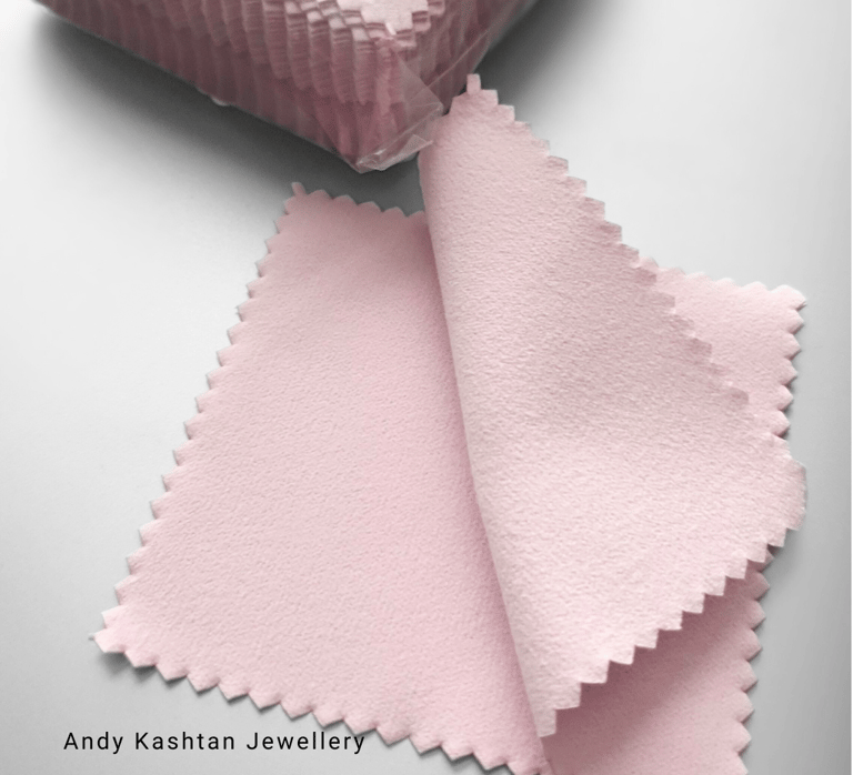 a pink and white cloth with a pink ribbon