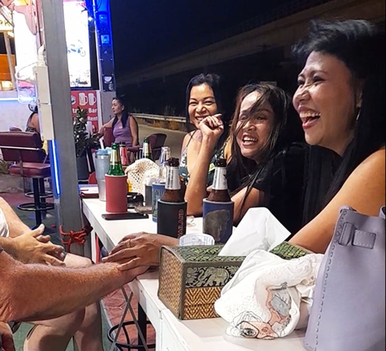 Thai women laughing at bar near Soi 94 in Hua Hin