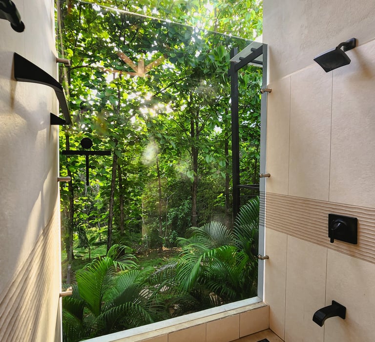 a bathroom with a large window and a view