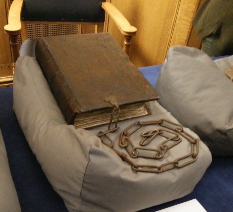 A bound manuscript with a chain.