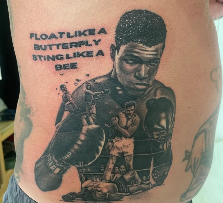 a picture of realistic Muhammed Ali tattoo with a quote from a customer