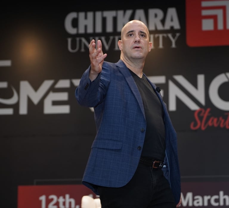 Ashwin Mushran speaking on stage