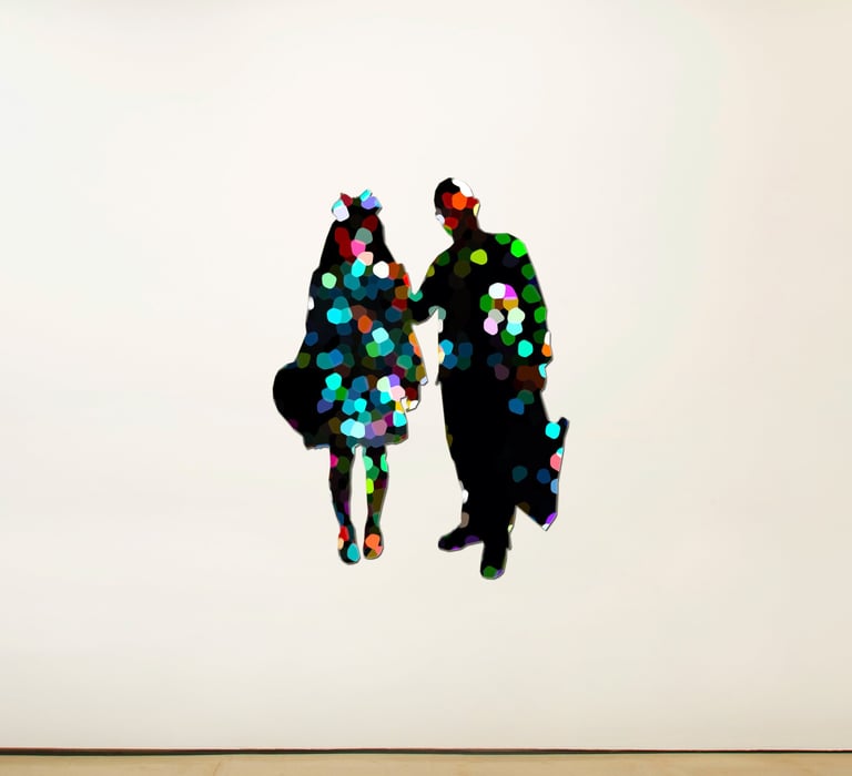 a couple of people standing in front of a white wall