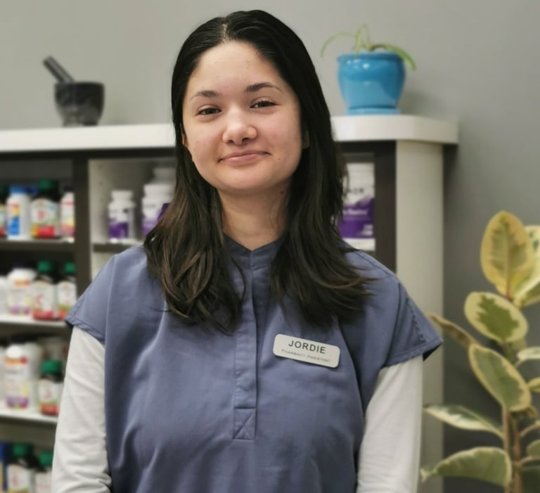 picture of woman with dark hair wearing blue scrubs