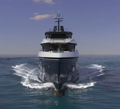 a boat in the water with a large boat in the background