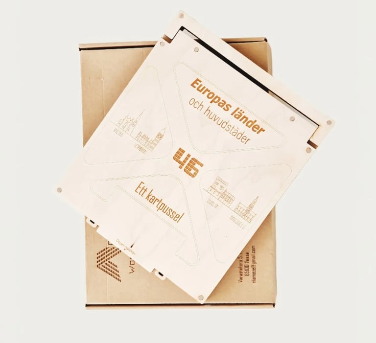 A wooden laser-cut map puzzle of Europe featuring countries and capitals on a cardboard shipping box.