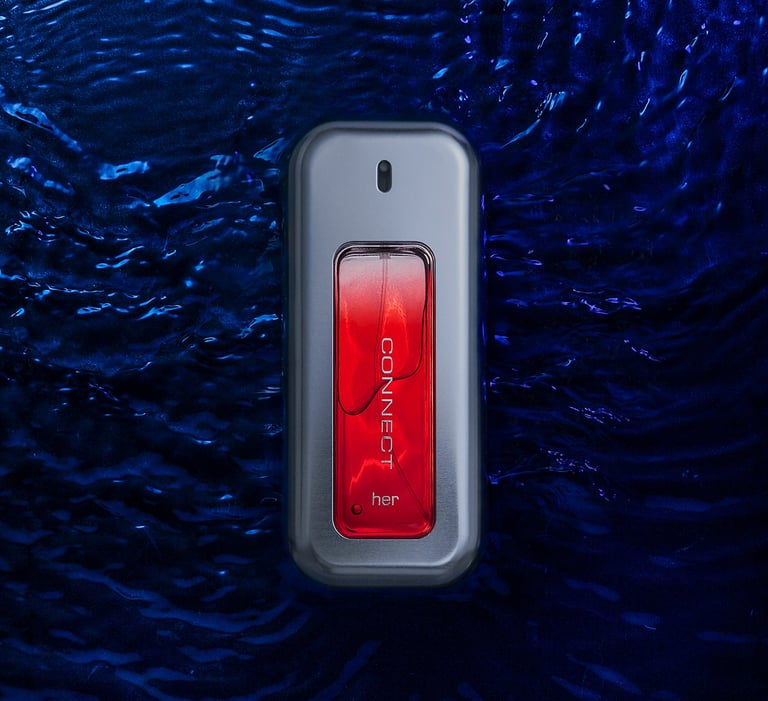 Bottle of perfume laying flat in water