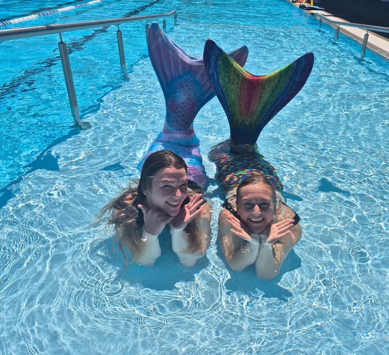 Adult Mermaids in a pool