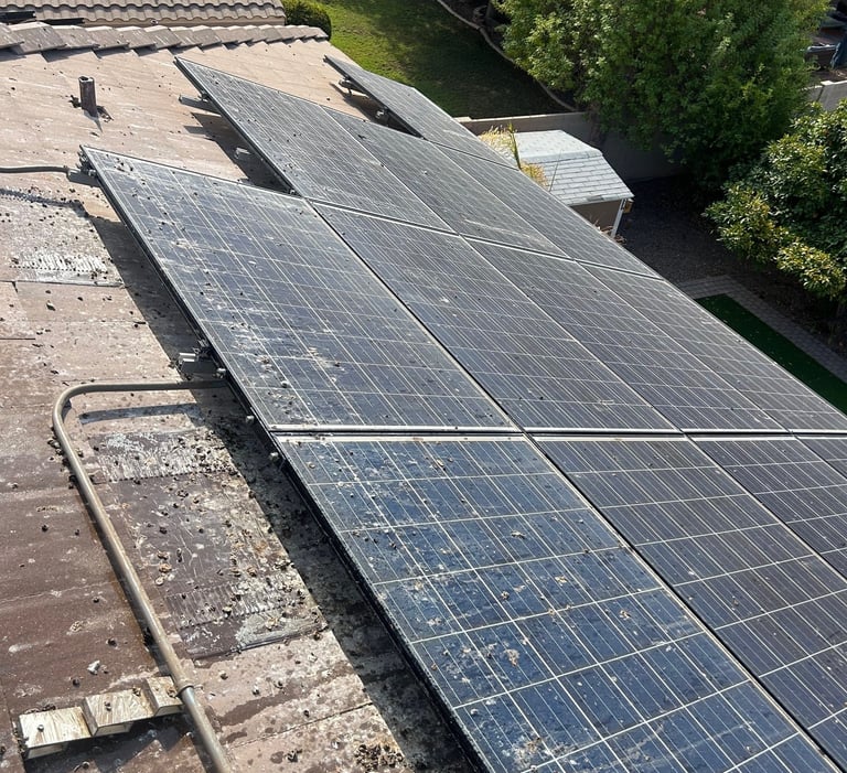 pigeon droppings and poop on roof and solar panels before our service in phoenix arizona