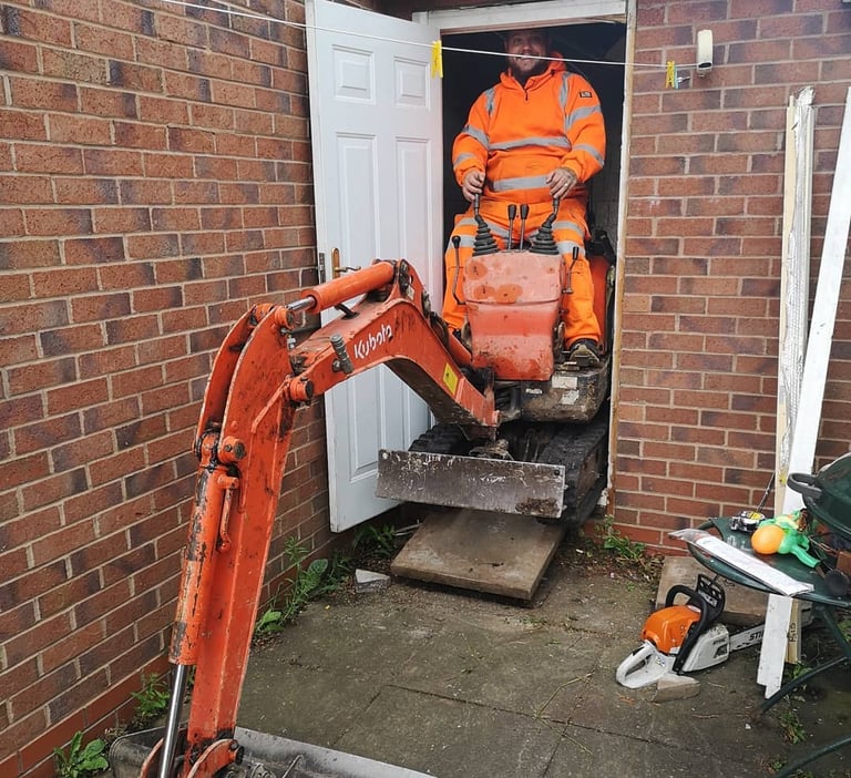 Digger operator preparing foundation in West Bromwich