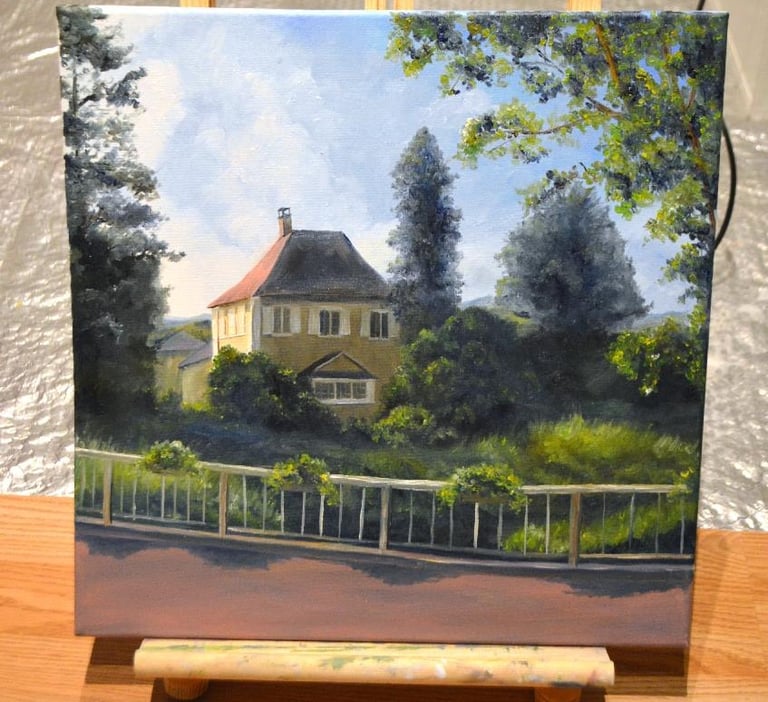 a painting of a house with a fenced adorned with hanging green plants
