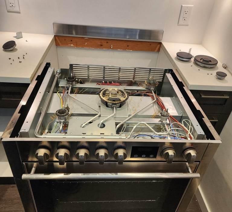 Stainless steel stove, top is removed for maintenance repair