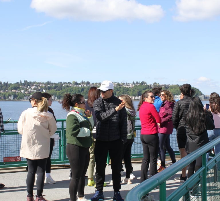 team on the Seattle ferry heading to Bainbridge Island for a team building retreat