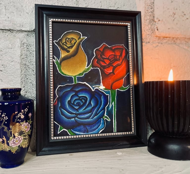 Rose paining over fireplace with vase and candle