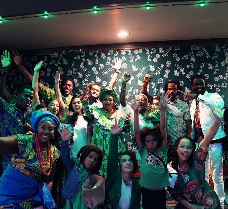 a group of people standing around a stage