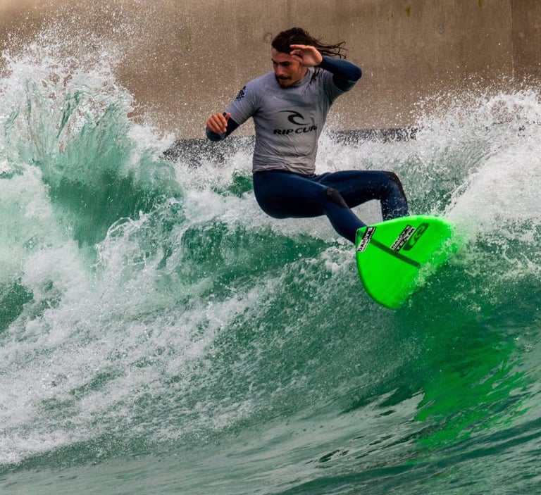Instructor doing a top turn, surfing a green wave surf
