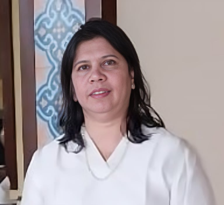 a woman in a white shirt and a blue and white wall