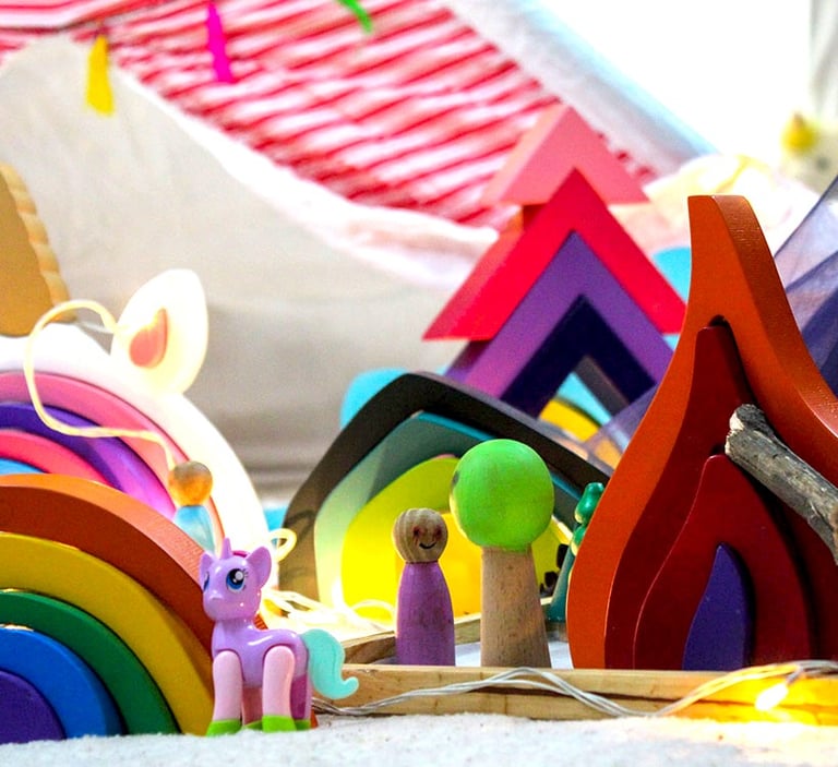 a toy horse and a toy horse are on the floor