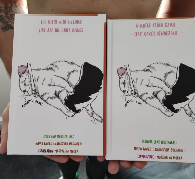 a man holding two books in his hands