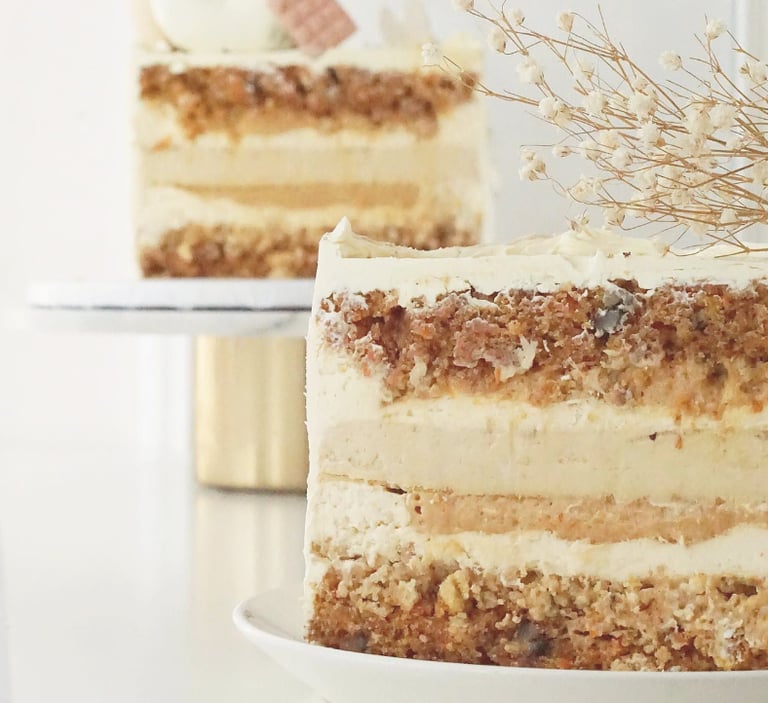 a cake with a white frosting and a flower