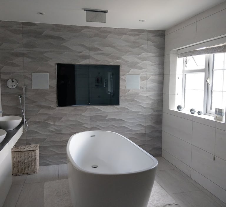 Waterproof bathroom TV installation in Milton Keynes home.