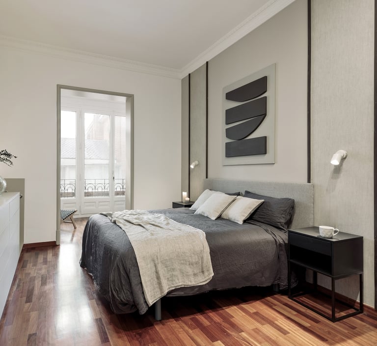 Elegant bedroom design with custom wall panels and bold decor details, designed by SAVIA