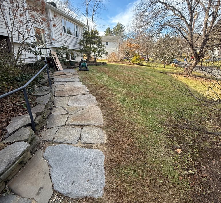 Junk removal truck loaded with debris during Greenfield job