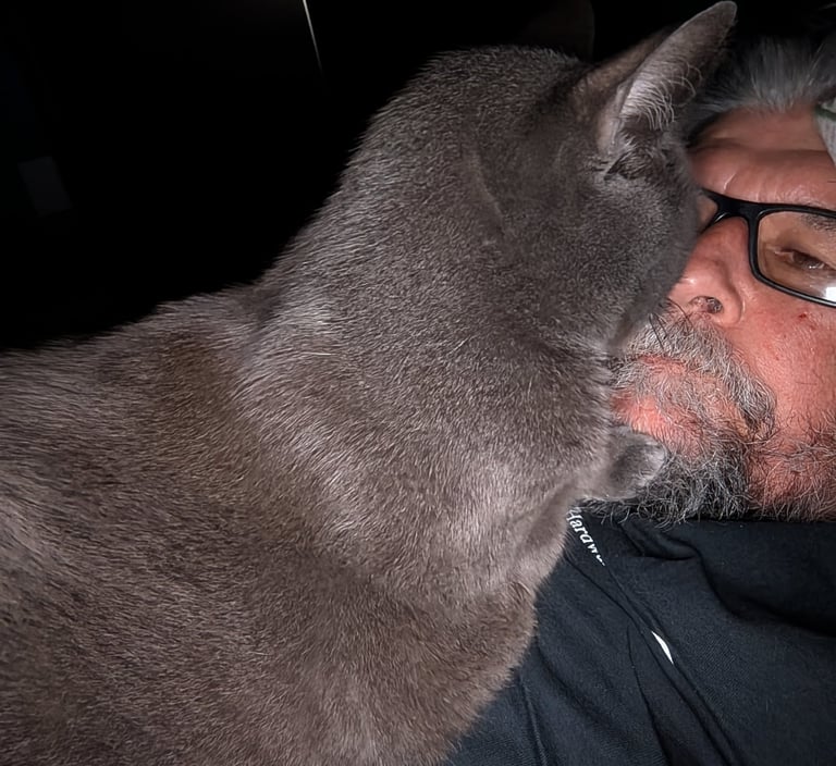 Greg Rowland with his cat Big Bit
