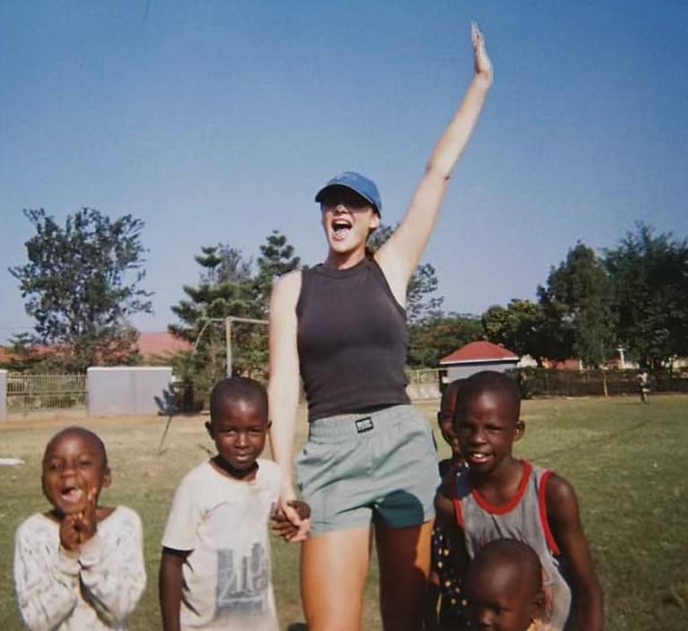 Ellen Guiney with kids in Africa