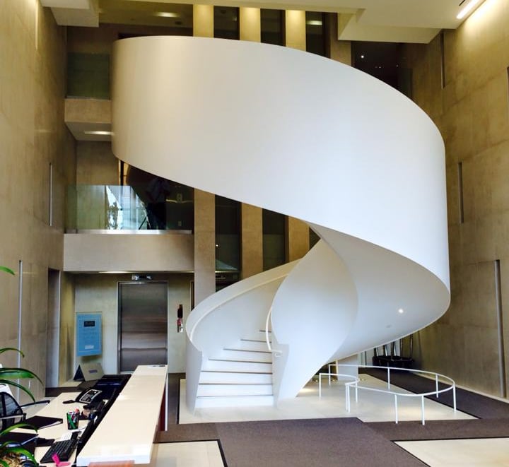 Uniquely beautiful elliptical feature staircase in residential building's lobby, by Pengelly Iron Works
