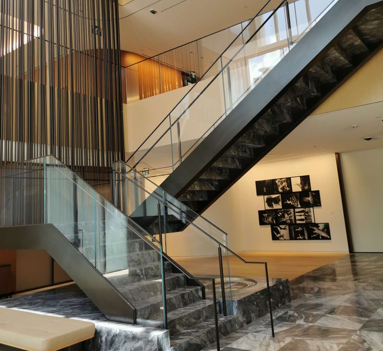 Second angle of Scotiabank North marble feature stairs, by by Pengelly Iron Works