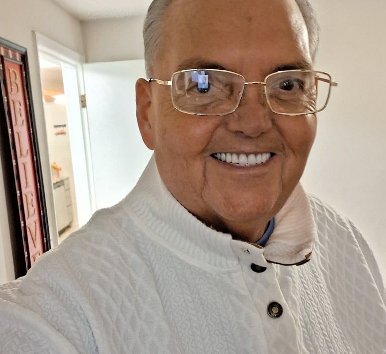 a man in a white shirt and glasses