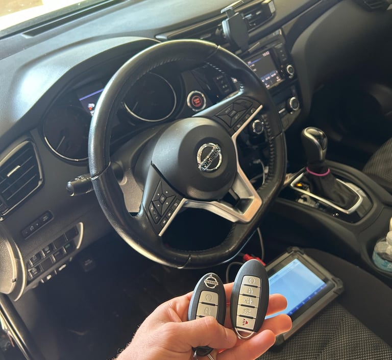 locksmith programming a car key fob on-site for a modern vehicle in Flagler County