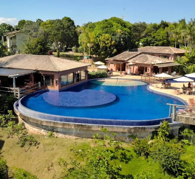 a large pool with a deck and a deck with chairs