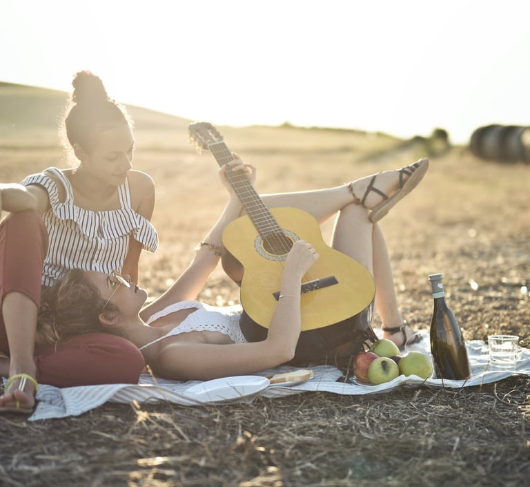 two women playing guitar