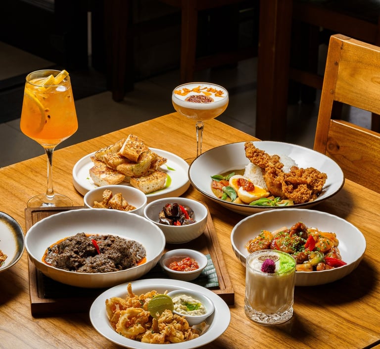 a table with plates of food and drinks